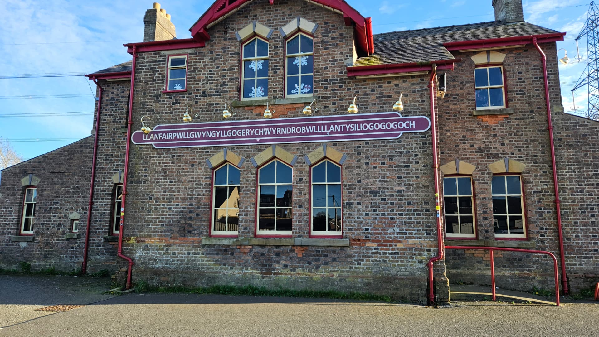 The old station building at Llanfairpwllgwyngyll with its famously long name sign